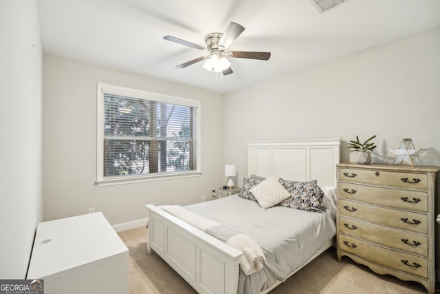 bedroom featuring light carpet, visible vents, ceiling fan, and baseboards