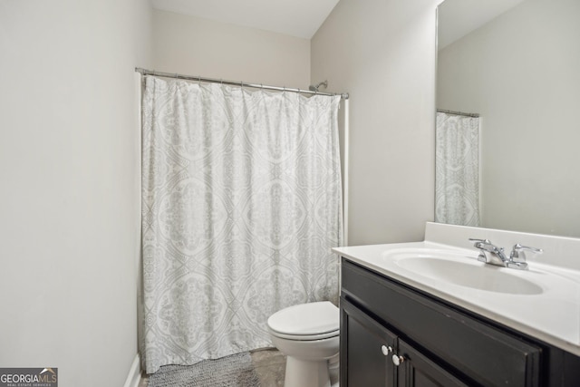 bathroom with vanity and toilet