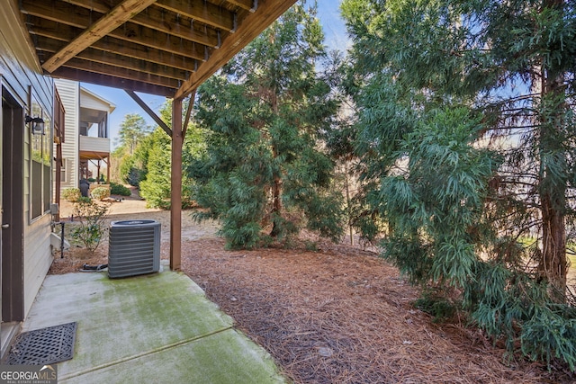 view of yard featuring a patio and central AC unit