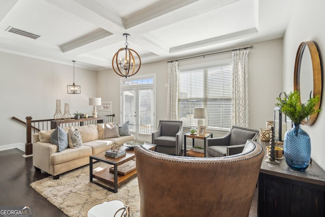 living room featuring visible vents, coffered ceiling, beam ceiling, dark wood-style flooring, and a notable chandelier