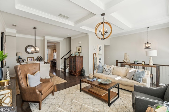 living room featuring a notable chandelier, wood finished floors, and visible vents