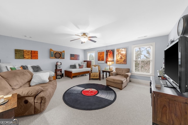 living room featuring plenty of natural light, visible vents, and carpet floors