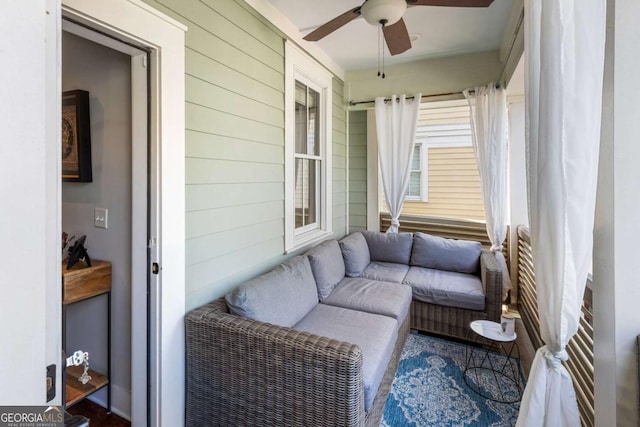 sunroom featuring ceiling fan