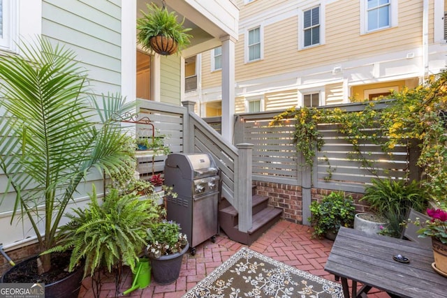 view of patio featuring a grill