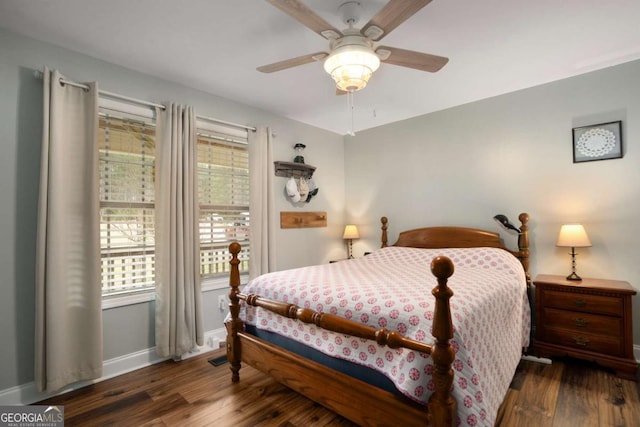 bedroom with wood finished floors, baseboards, and ceiling fan