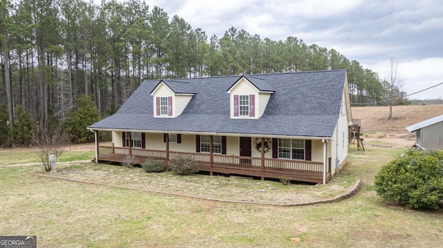 view of front of house featuring covered porch, a front yard, and roof with shingles