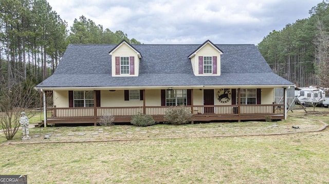 view of front of house featuring a front lawn and covered porch