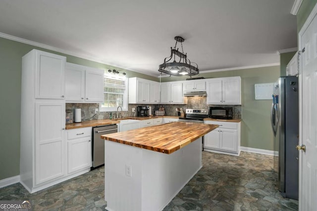 kitchen featuring under cabinet range hood, wood counters, white cabinets, and stainless steel appliances