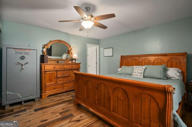 bedroom with a ceiling fan and wood finished floors