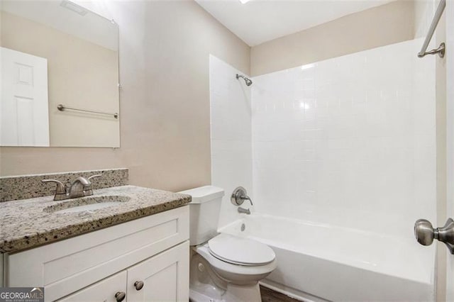 full bathroom with tub / shower combination, toilet, and vanity