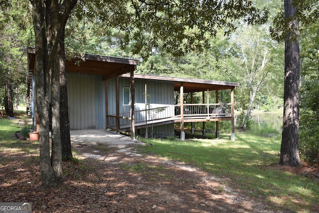 exterior space featuring a deck and a front yard