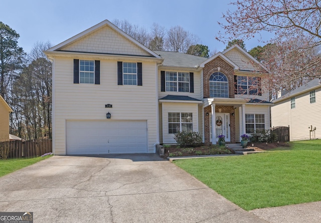 view of front of home with fence, concrete driveway, a front yard, a garage, and brick siding