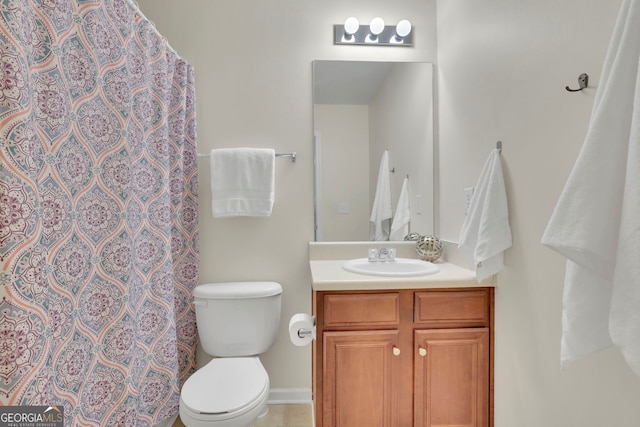 bathroom featuring a shower with curtain, toilet, and vanity