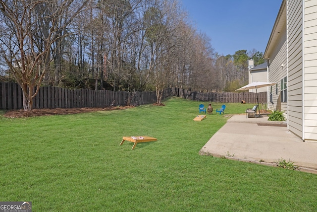 view of yard featuring a patio and a fenced backyard