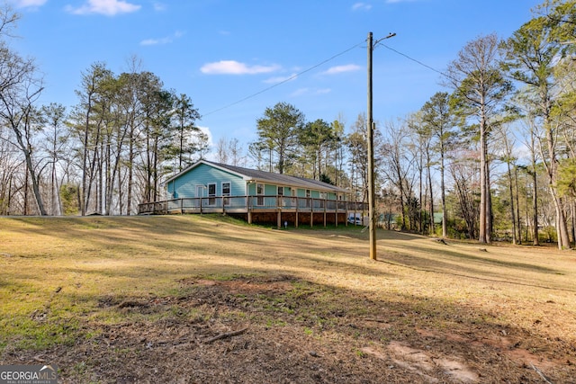 4864 Yeagar Rd, Douglasville, GA 30135 - exterior space with a front yard and a wooden deck