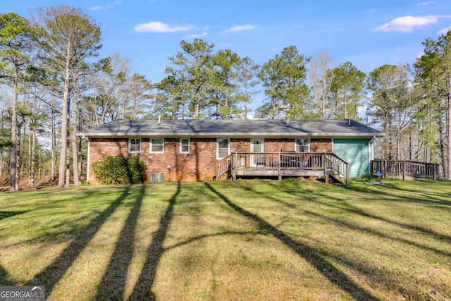 4864 Yeagar Rd, Douglasville, GA 30135 - rear view of property with a yard, a wooden deck, brick siding, and central AC unit