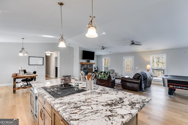 4864 Yeagar Rd, Douglasville, GA 30135 - kitchen with light wood-style floors, vaulted ceiling, black electric stovetop, and a ceiling fan
