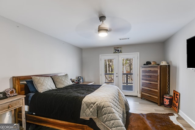 4864 Yeagar Rd, Douglasville, GA 30135 - bedroom featuring french doors, visible vents, access to exterior, and light wood-style flooring