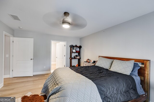 4864 Yeagar Rd, Douglasville, GA 30135 - bedroom featuring light wood-type flooring, baseboards, a ceiling fan, and visible vents