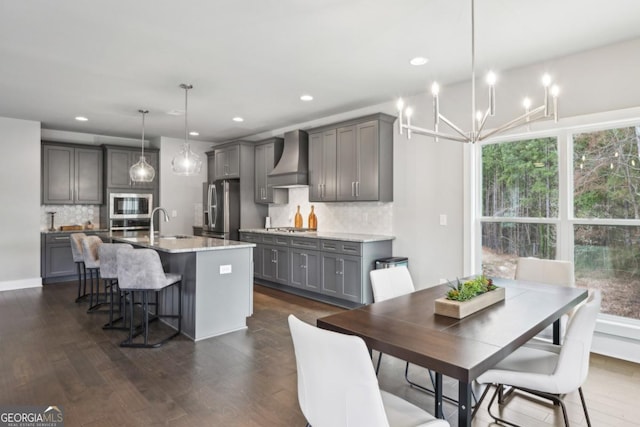 dining area featuring dark wood-style floors, a notable chandelier, and recessed lighting