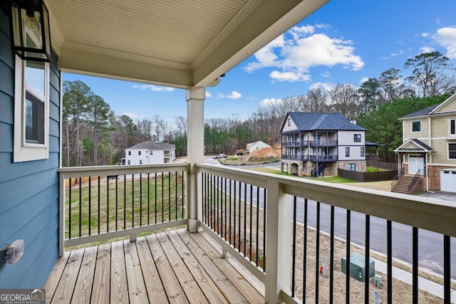 wooden deck with a residential view