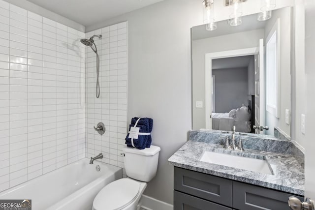 ensuite bathroom featuring toilet, vanity, connected bathroom, and  shower combination