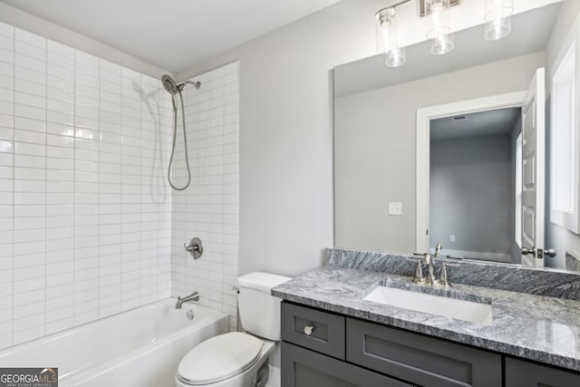 full bath with vanity, toilet, and washtub / shower combination