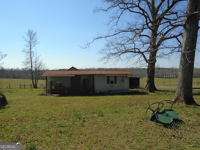 rear view of house with a lawn