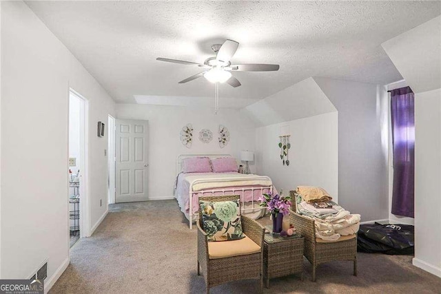 bedroom with baseboards, carpet flooring, a textured ceiling, and ceiling fan