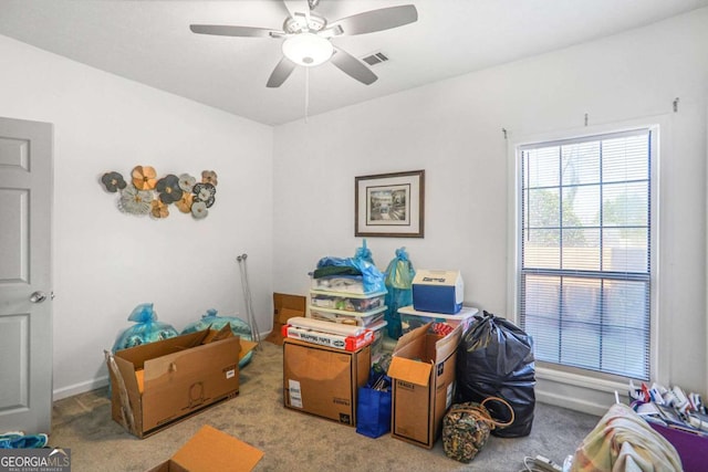 storage area featuring visible vents and ceiling fan