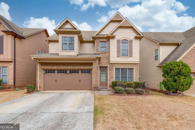 craftsman-style house with concrete driveway, an attached garage, and brick siding