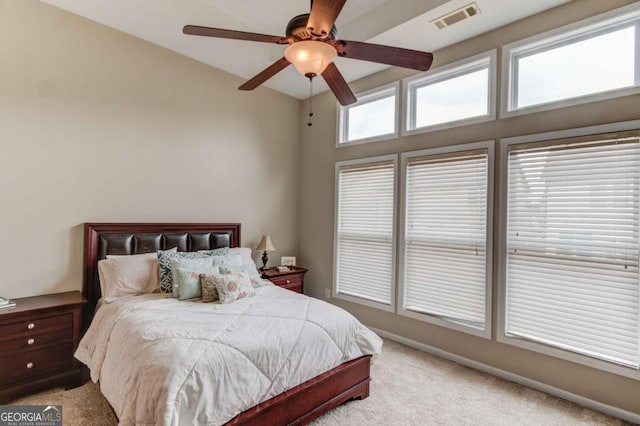 bedroom with carpet flooring, a ceiling fan, visible vents, and baseboards