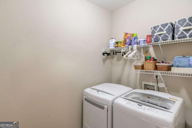 washroom with laundry area and washing machine and dryer