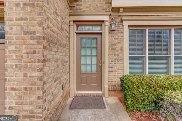 property entrance with brick siding