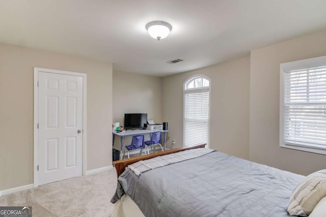 bedroom featuring visible vents, baseboards, and carpet flooring