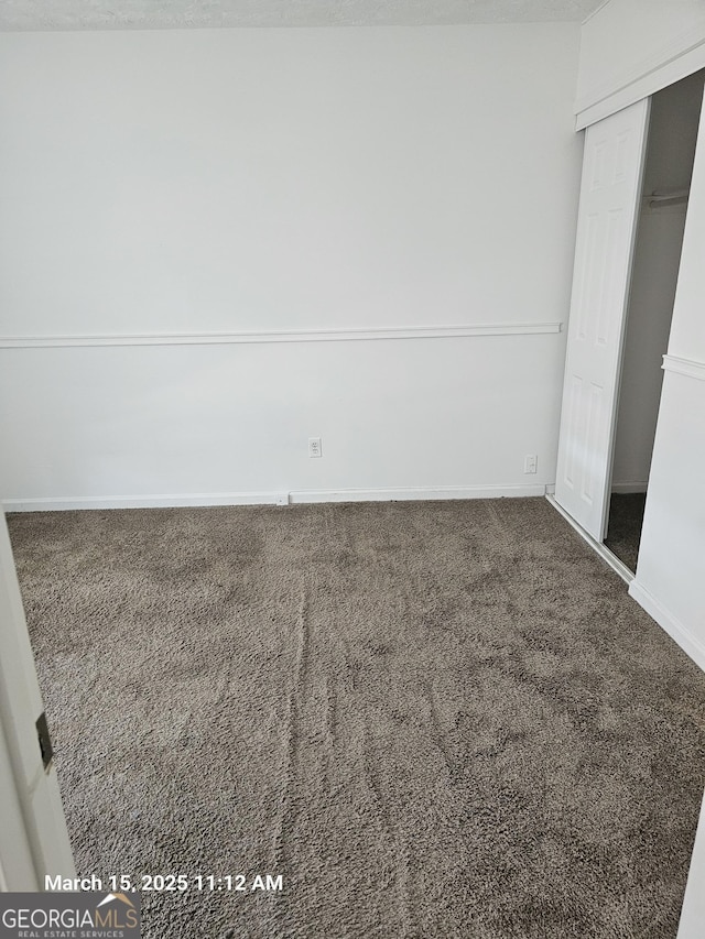 11187 Shannon Cir, Hampton, GA 30228 - unfurnished bedroom featuring carpet flooring and a closet