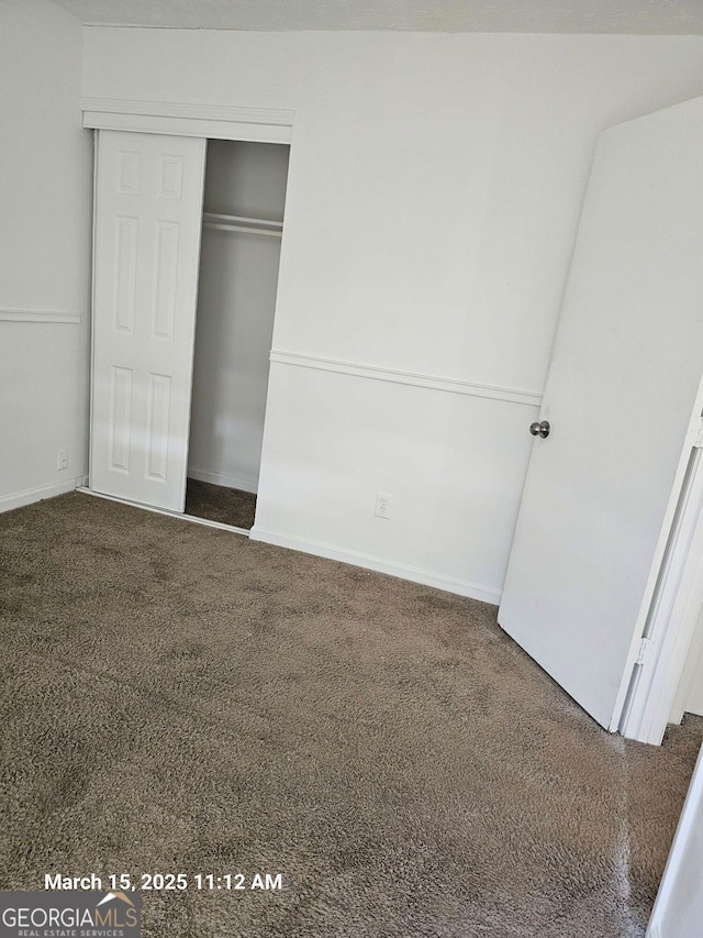 11187 Shannon Cir, Hampton, GA 30228 - unfurnished bedroom featuring carpet and a closet