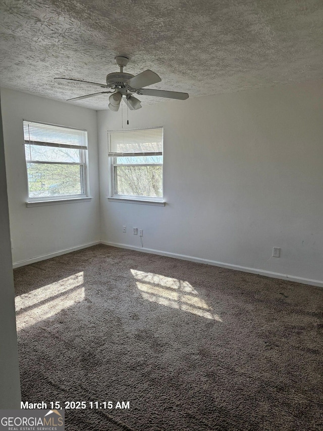 11187 Shannon Cir, Hampton, GA 30228 - spare room featuring a ceiling fan, baseboards, a textured ceiling, and carpet flooring