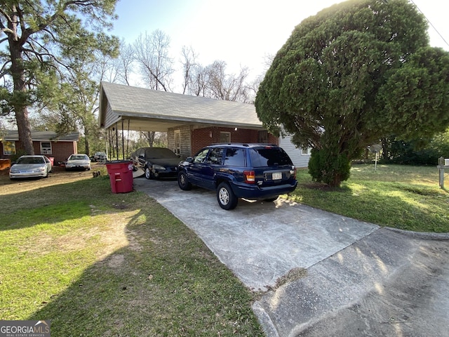 view of front of property with a carport, a front yard, brick siding, and driveway