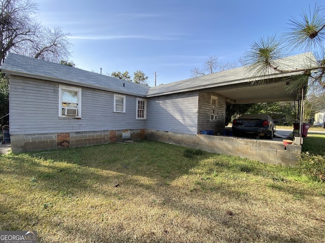 exterior space with a carport and a front yard