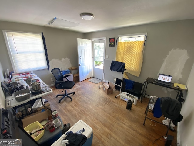 office area with wood finished floors and baseboards