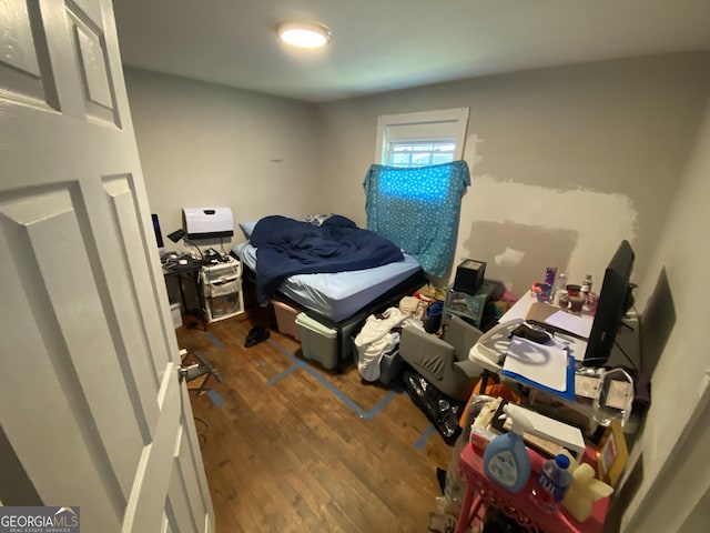 bedroom featuring wood finished floors