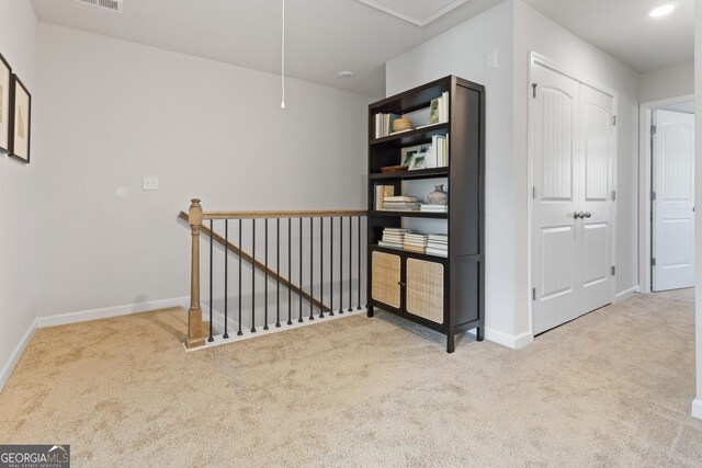 227 Ivey Ter Unit 36, Temple, GA 30179 - hall featuring attic access, an upstairs landing, carpet, and baseboards