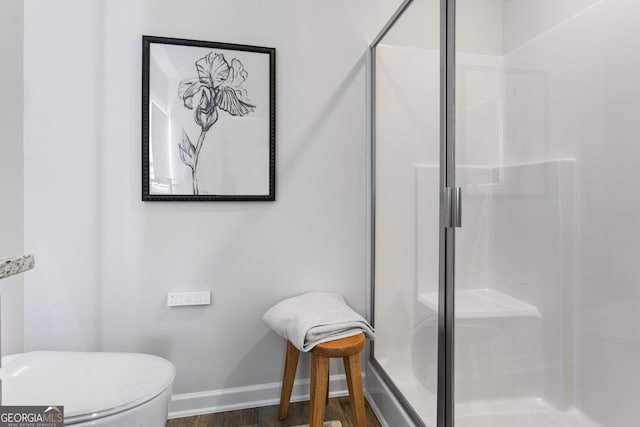 227 Ivey Ter Unit 36, Temple, GA 30179 - full bath with a shower stall, baseboards, wood finished floors, and toilet
