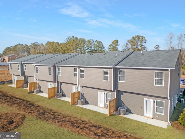 227 Ivey Ter Unit 36, Temple, GA 30179 - rear view of property with a patio area, a lawn, roof with shingles, and central AC
