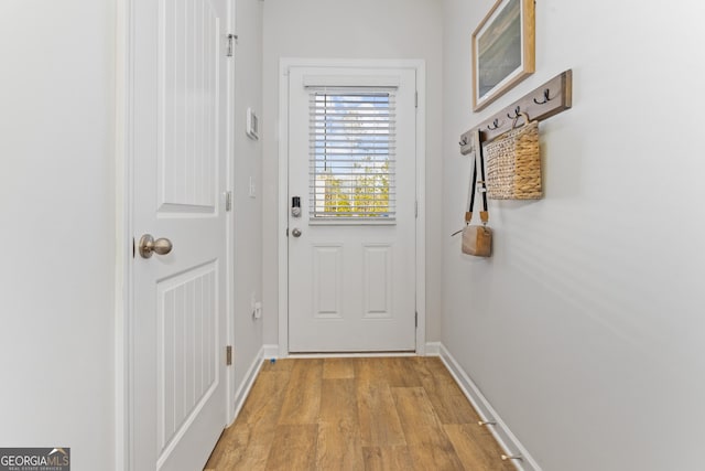 227 Ivey Ter Unit 36, Temple, GA 30179 - doorway with light wood-style floors and baseboards
