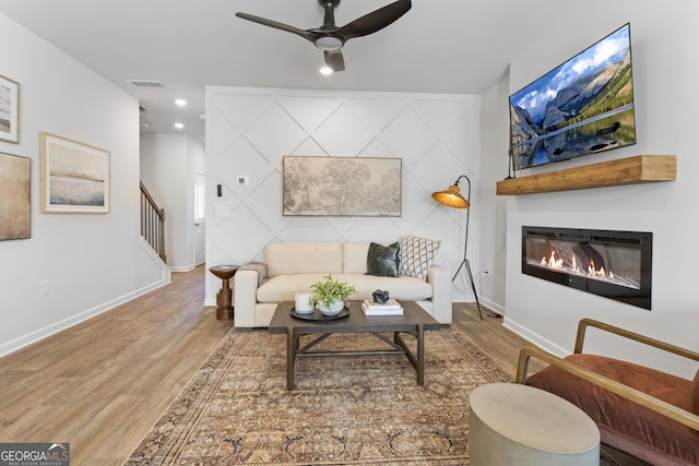 227 Ivey Ter Unit 36, Temple, GA 30179 - living area featuring wood finished floors, a ceiling fan, a glass covered fireplace, baseboards, and recessed lighting