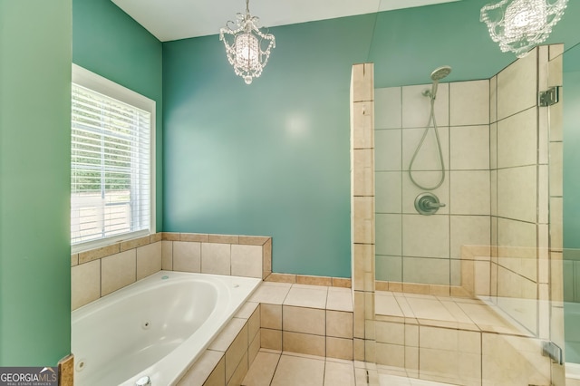 full bath with a tile shower, tile patterned flooring, a notable chandelier, and a tub with jets
