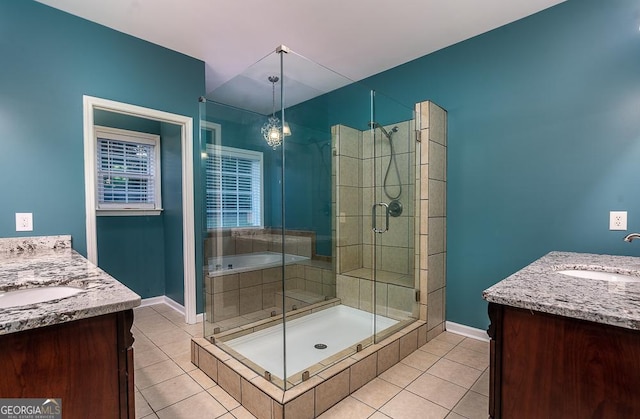 bathroom featuring a shower stall, tile patterned flooring, and vanity