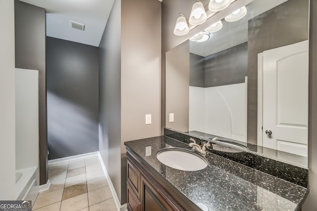 full bath featuring baseboards, vanity, tile patterned floors, and visible vents